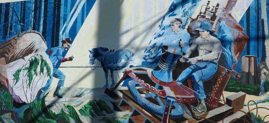 Winching a log, likely depicted with dramatic licence, on a Chemainus mural